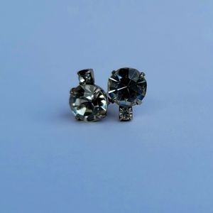 Two diamond stud earrings